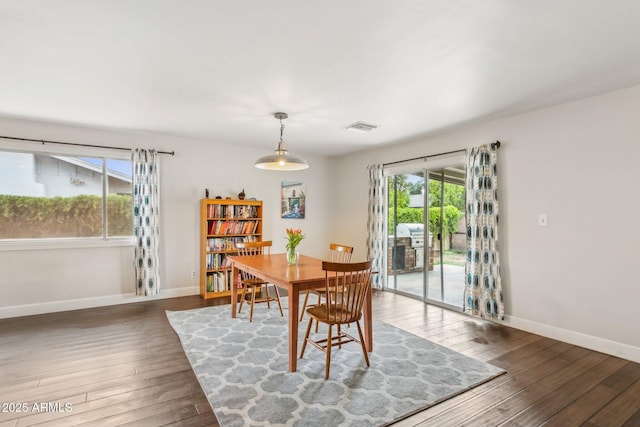 1649 W Royal Palm Rd, Phoenix, AZ 85021 - dining area featuring hardwood / wood-style flooring and baseboards