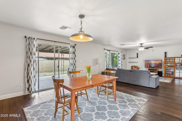 1649 W Royal Palm Rd, Phoenix, AZ 85021 - dining area with a ceiling fan, wood-type flooring, and baseboards