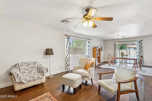 1649 W Royal Palm Rd, Phoenix, AZ 85021 - living area with healthy amount of natural light, wood finished floors, and ceiling fan