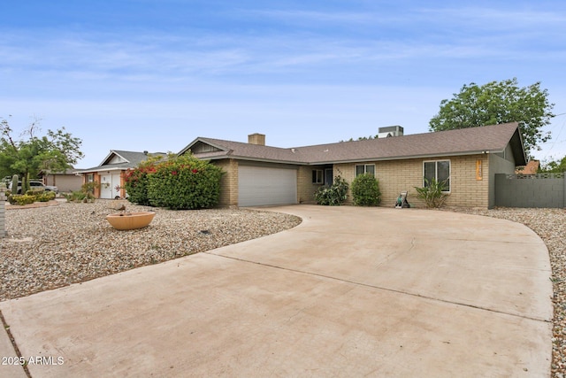 1649 W Royal Palm Rd, Phoenix, AZ 85021 - single story home with driveway, brick siding, an attached garage, and fence