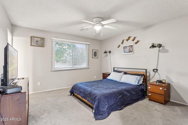 1649 W Royal Palm Rd, Phoenix, AZ 85021 - carpeted bedroom with a textured ceiling, baseboards, and ceiling fan