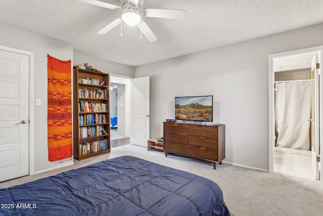 1649 W Royal Palm Rd, Phoenix, AZ 85021 - carpeted bedroom with a textured ceiling, ensuite bath, ceiling fan, and baseboards