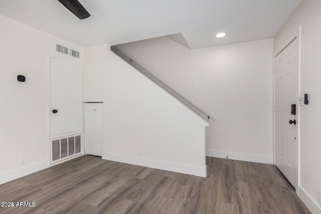 entryway with dark hardwood / wood-style flooring