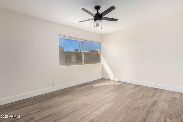 unfurnished room featuring ceiling fan and wood-type flooring