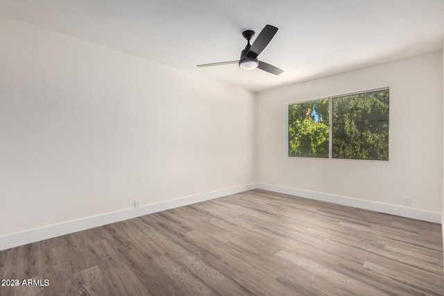 unfurnished room featuring hardwood / wood-style flooring and ceiling fan