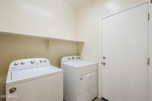 washroom featuring laundry area and washing machine and dryer