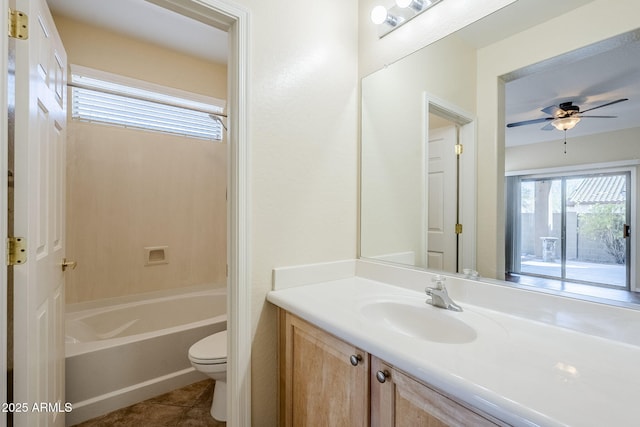 full bathroom with tile patterned flooring, toilet, bathtub / shower combination, vanity, and a ceiling fan