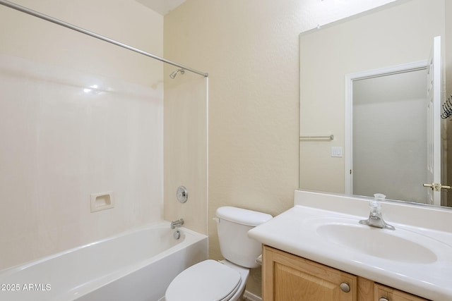 bathroom featuring vanity, toilet, and shower / bathtub combination