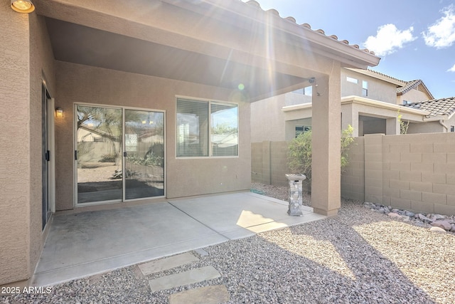 view of patio featuring fence