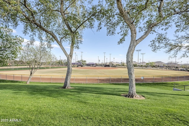 view of home's community with a yard