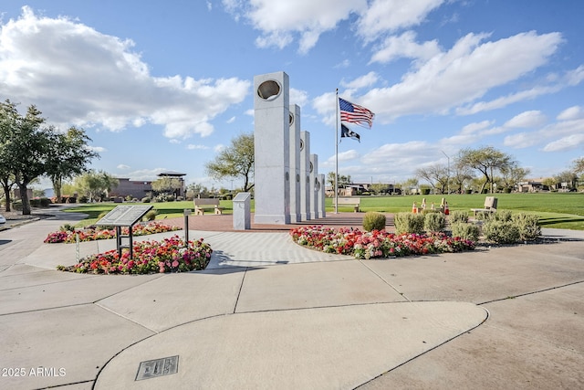 view of property's community with a yard