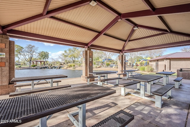 view of patio / terrace featuring a gazebo and a water view