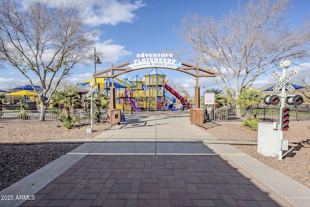 view of community with playground community and fence