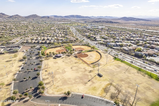 drone / aerial view featuring a residential view and a mountain view