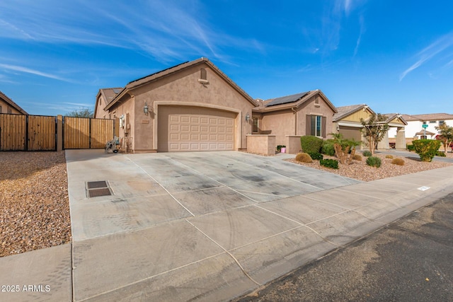 ranch-style home with solar panels and a garage