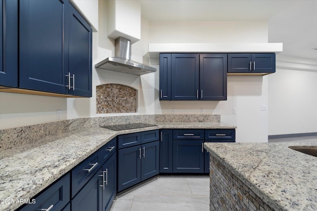 28301 N 154th St, Scottsdale, AZ 85262 - kitchen with black electric stovetop, blue cabinets, and light stone counters