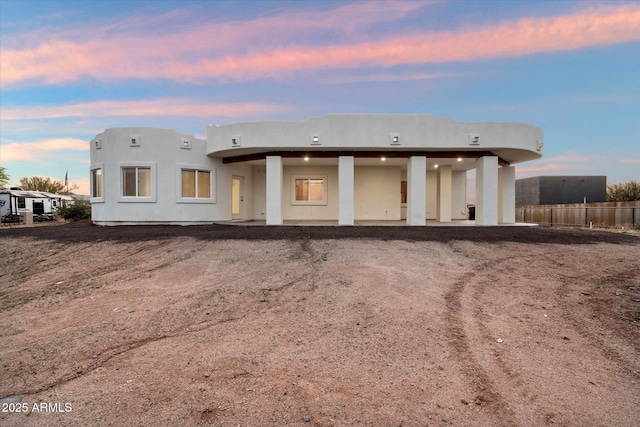 28301 N 154th St, Scottsdale, AZ 85262 - back of house at dusk featuring stucco siding and fence