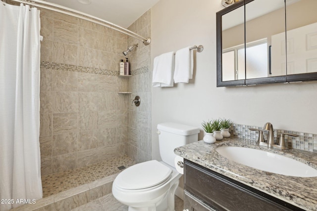 8107 E Mitchell Dr, Scottsdale, AZ 85251 - full bathroom with vanity, toilet, and a tile shower