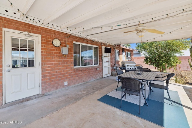 8107 E Mitchell Dr, Scottsdale, AZ 85251 - view of patio featuring a grill, outdoor dining space, a ceiling fan, and fence