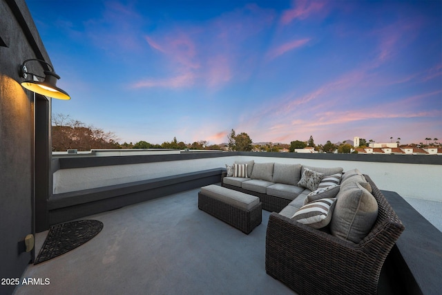 patio terrace at dusk with an outdoor living space