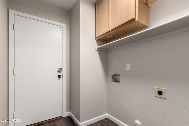washroom featuring dark wood-style flooring, baseboards, hookup for a washing machine, electric dryer hookup, and cabinet space