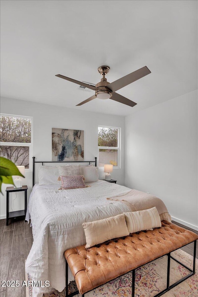 6747 N 12th St, Phoenix, AZ 85014 - bedroom featuring ceiling fan and wood finished floors