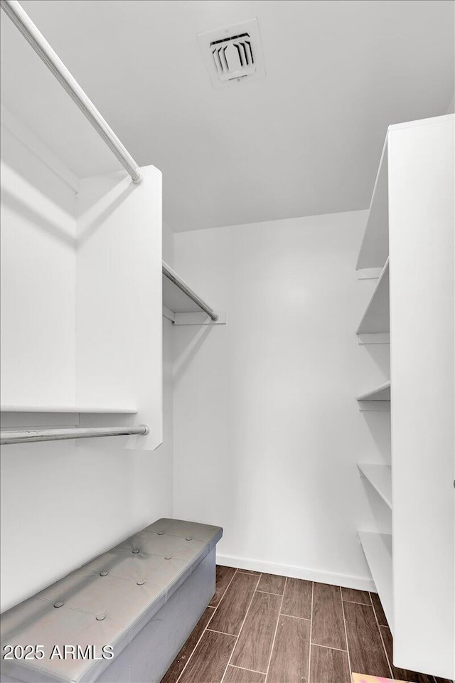 6747 N 12th St, Phoenix, AZ 85014 - walk in closet with visible vents and wood finish floors