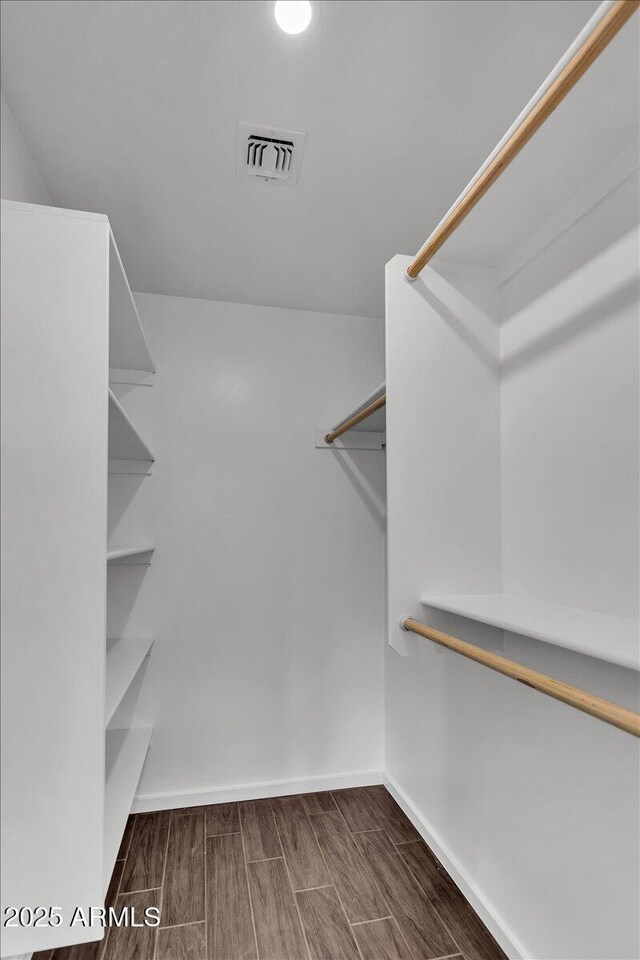 6747 N 12th St, Phoenix, AZ 85014 - walk in closet with wood finish floors and visible vents
