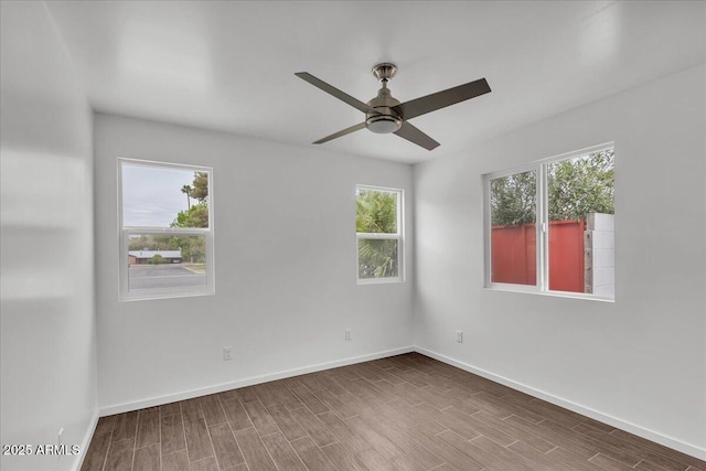 6747 N 12th St, Phoenix, AZ 85014 - unfurnished room featuring baseboards, wood finished floors, and a ceiling fan