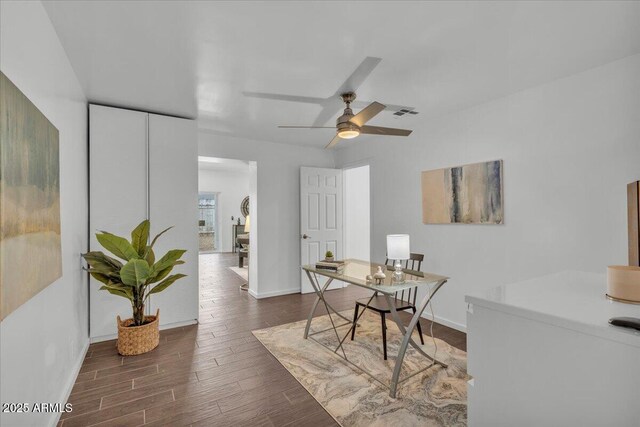 6747 N 12th St, Phoenix, AZ 85014 - dining space with dark wood-style floors, baseboards, and ceiling fan