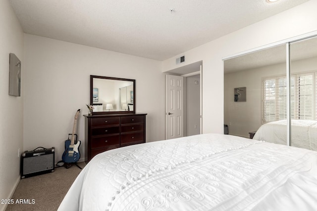 bedroom featuring carpet, a closet, visible vents, and baseboards