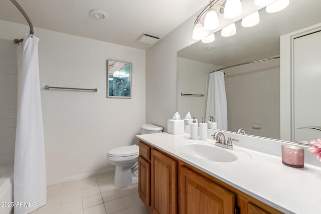 bathroom featuring visible vents, toilet, vanity, baseboards, and tile patterned floors