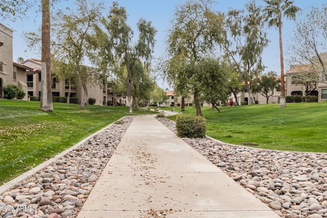 view of property's community featuring a residential view and a lawn