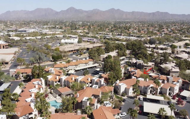 drone / aerial view featuring a residential view and a mountain view