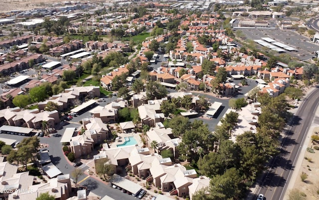 birds eye view of property with a residential view