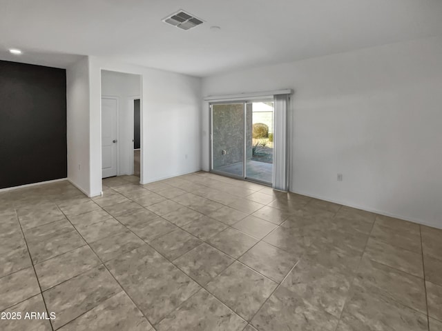 empty room with light tile patterned floors