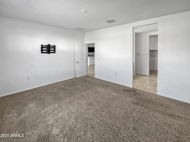 empty room featuring light carpet