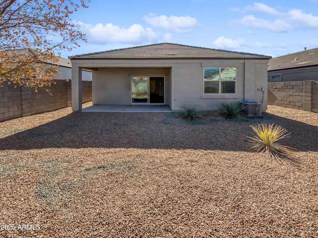 back of house with a patio area