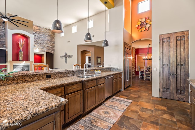 15406 E Cavedale Dr, Scottsdale, AZ 85262 - kitchen featuring a sink, stainless steel appliances, a high ceiling, stone countertops, and stone finish flooring