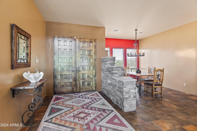 15406 E Cavedale Dr, Scottsdale, AZ 85262 - foyer featuring a chandelier and dark stone finish floors