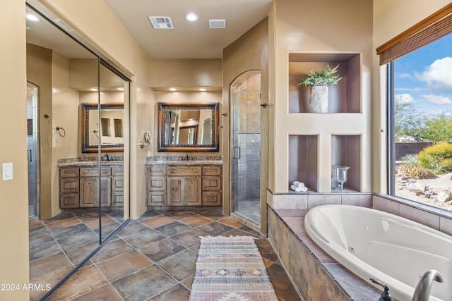 15406 E Cavedale Dr, Scottsdale, AZ 85262 - bathroom featuring a jetted tub, a stall shower, vanity, stone finish floors, and recessed lighting