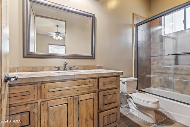 15406 E Cavedale Dr, Scottsdale, AZ 85262 - bathroom with toilet, vanity, a ceiling fan, enclosed tub / shower combo, and tile patterned flooring
