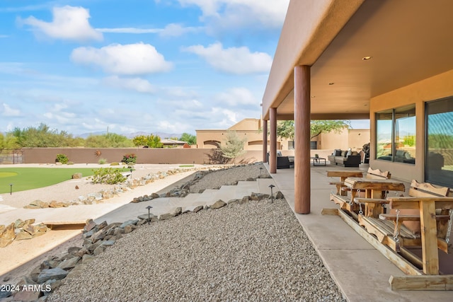 15406 E Cavedale Dr, Scottsdale, AZ 85262 - fenced backyard featuring outdoor lounge area, a patio area, and an area to practice putting