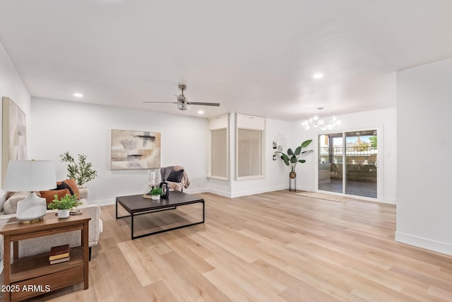 interior space featuring light wood-type flooring, baseboards, and recessed lighting