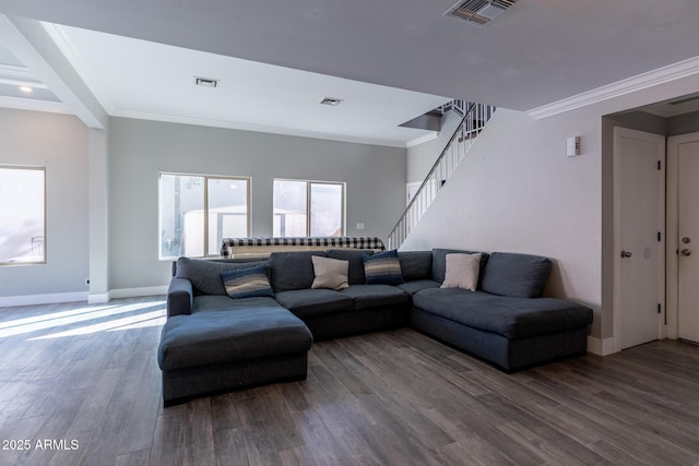 living room featuring wood-type flooring and ornamental molding