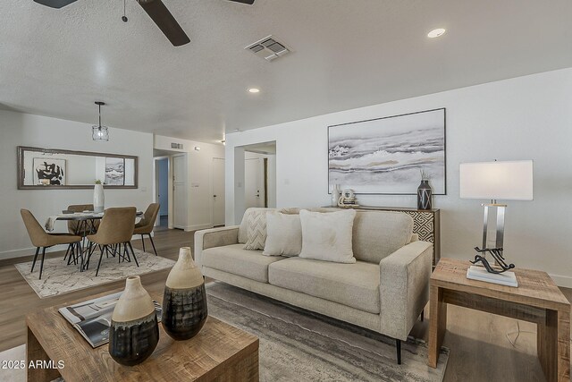 16421 N 34th Ave, Phoenix, AZ 85053 - living area with a ceiling fan, wood finished floors, recessed lighting, and a textured ceiling