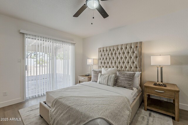 16421 N 34th Ave, Phoenix, AZ 85053 - bedroom with access to exterior, wood finished floors, and a ceiling fan