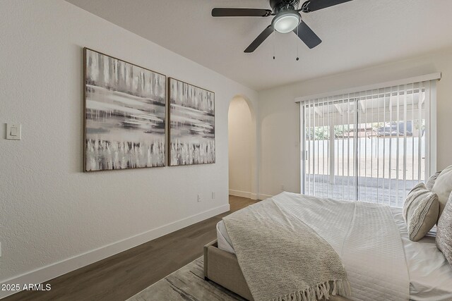 16421 N 34th Ave, Phoenix, AZ 85053 - bedroom with wood finished floors, access to exterior, arched walkways, and ceiling fan