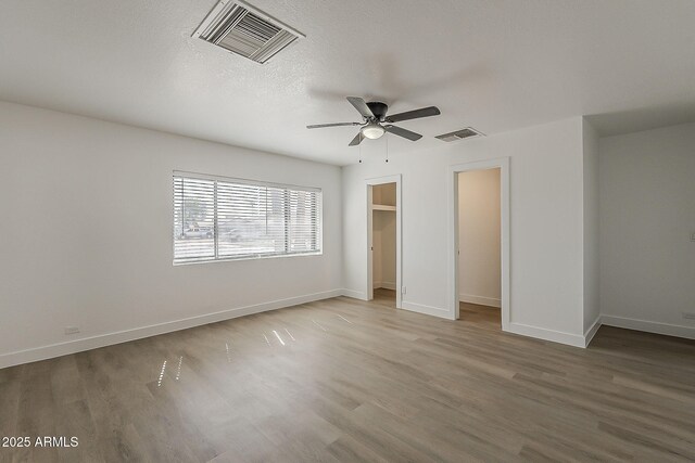 16421 N 34th Ave, Phoenix, AZ 85053 - unfurnished bedroom featuring wood finished floors and ceiling fan