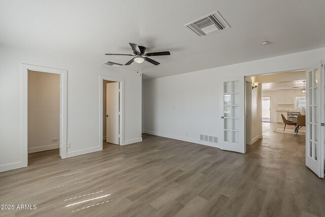 16421 N 34th Ave, Phoenix, AZ 85053 - unfurnished bedroom featuring french doors and wood finished floors